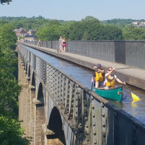 two people in canoe on aquaduct