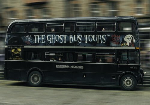 The ghost Bus tour logo on a black double darker bus Edinburgh