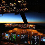 cockpit of plane at sunset in sky