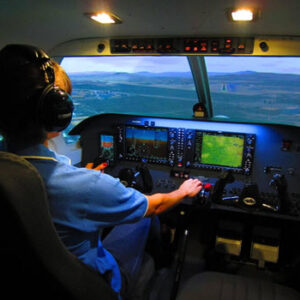 man flying plane inside cockpit