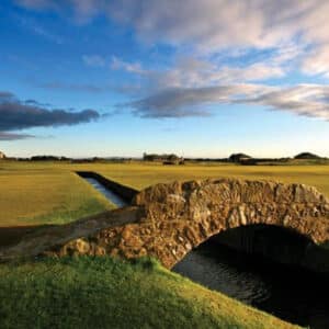 small hump bridge over water looking across St Andrews golf course