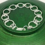 silver links on green background