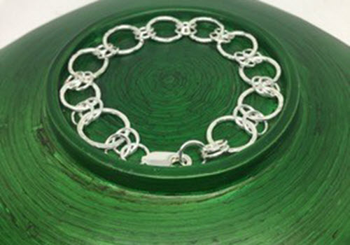 silver links on green background