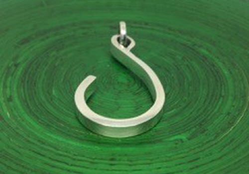silver s on green background