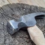 hammer head on dark black wood background