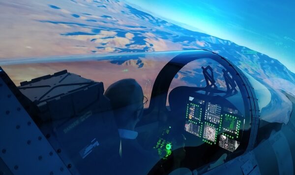shadow of man sitting in cockpit of a plane at sunset