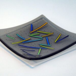 grey plate with coloured sticks