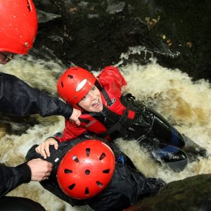 laughing child in rapid water