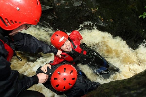 laughing child in rapid water